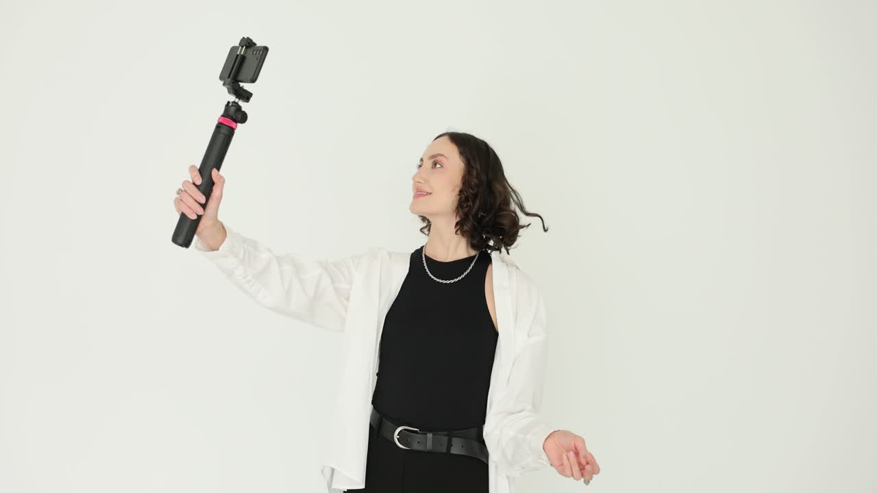 Woman taking selfie with selfie stick