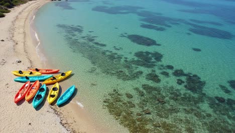 aesthetic seascape featuring colorful kayaks on crystal-clear waters along a serene sandy beach, perfect for adventurous water activities and relaxation