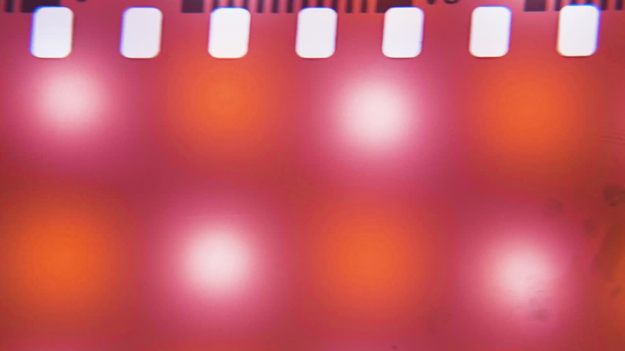 Abstract Film Negative with Purple, Pink, and Orange Light Leaks