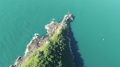 zenithal image captures the rugged beauty of a rocky island amidst a stunning blue sea