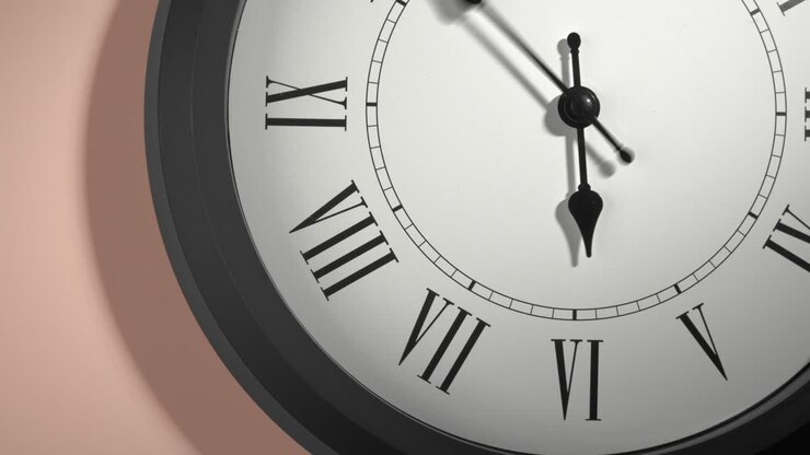 Latin Clock Face on Cream Beige Wall