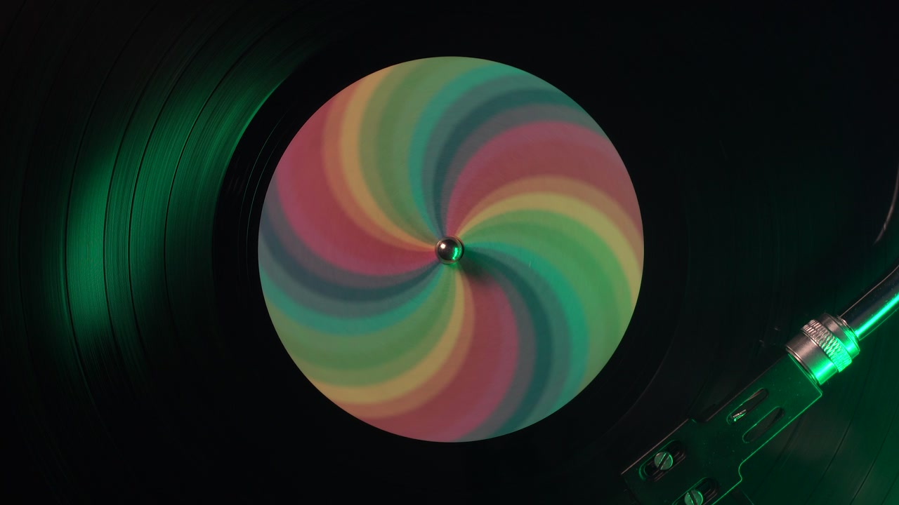 Spinning Vinyl Record With Rainbow Sticker, Top Down Close Up View