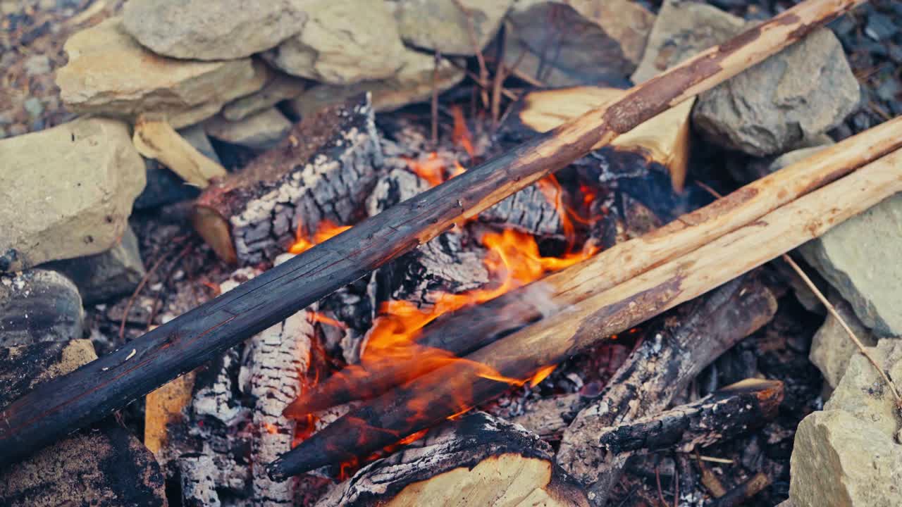Firewood With Blazing Flames Outdoor Hike. High Angle Shot