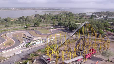 the streets are adorned with palm trees, and there is an amusement park with thrilling roller coasters