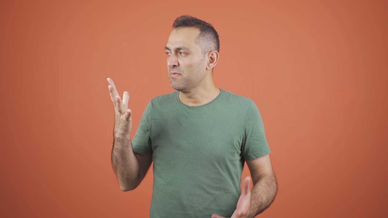 Angry businessman looking at camera.