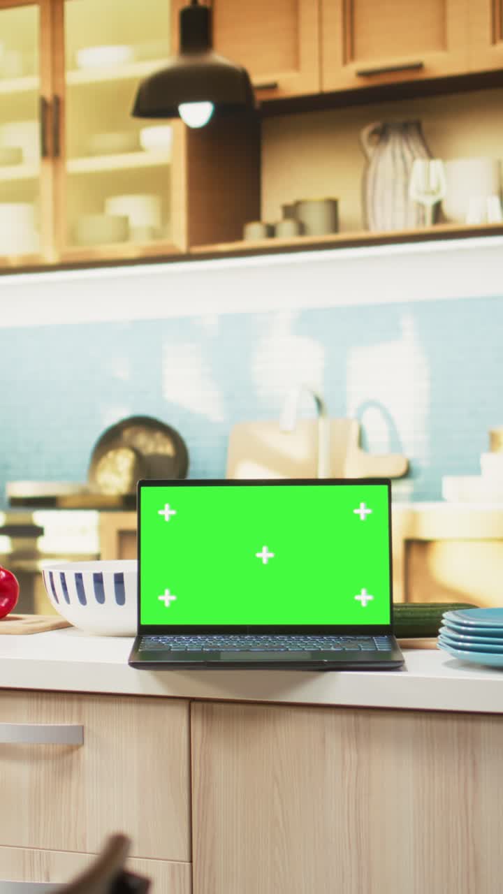 Vertical Video Chroma key display in kitchen interior with minimalist style furniture