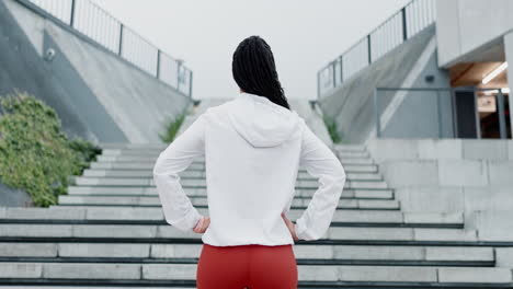 fitness, challenge and back of woman with stairs