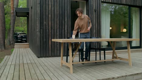 man working outdoors on a patio