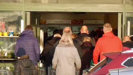 cornona covid virus shoppers rush panic buying at store doors uk retail
