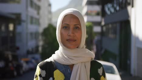 young woman wearing hijab out and about in the city