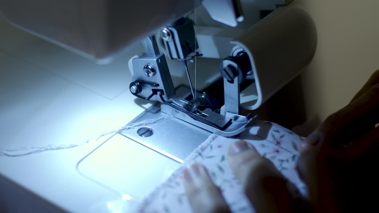 close up footage of sewing machine at night time