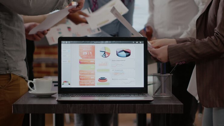 Close up of analysis charts on laptop in business meeting office