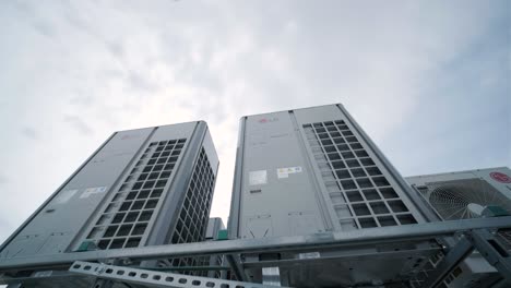 the air conditioning and ventilation system of a large industrial facility is located on the roof. it includes an air conditioner, smoke exhaust, and ventilation.