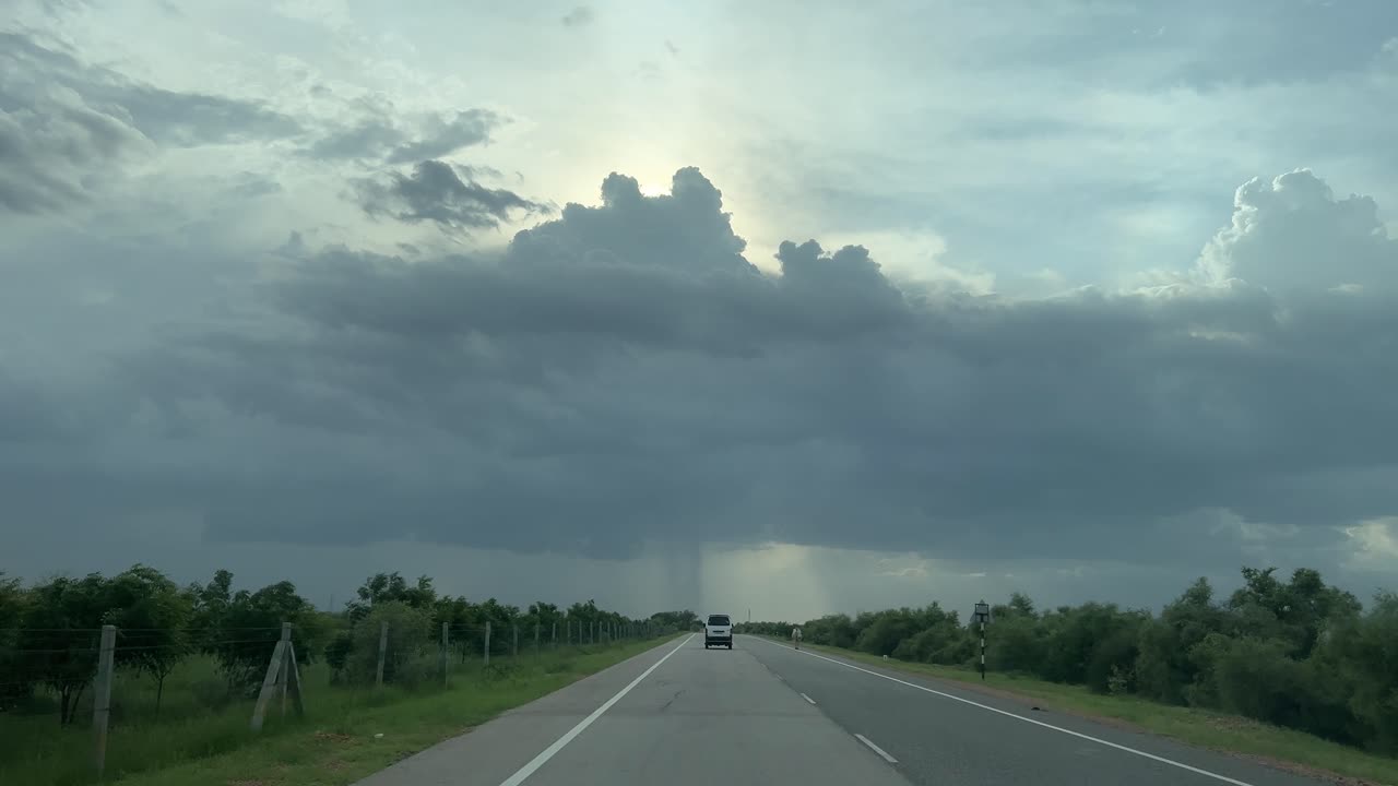long drive road, rain clouds on road, romantic atmosphere.