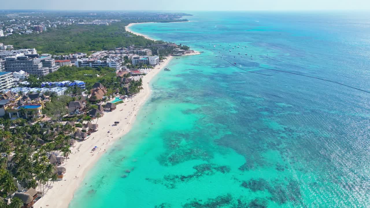 Tropical beach shoreline with turquoise sea in Playa del Carmen, Mexico