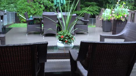 Rain-lightly-pattering-on-a-suburban-deck-during-a-summer-storm-with-a-cold-cool-look