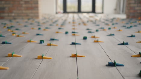 ceramic tiles being laid on the floor 1