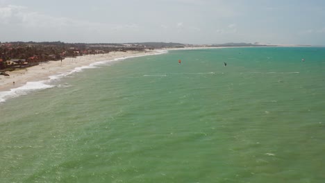 Aerial:-Cumbuco-during-day-with-people-kitesurfing