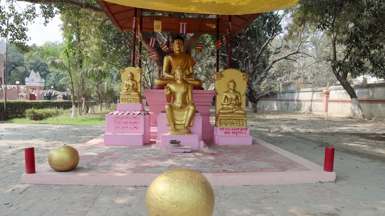 holy golden buddha statues displayed in different postures at outdoor