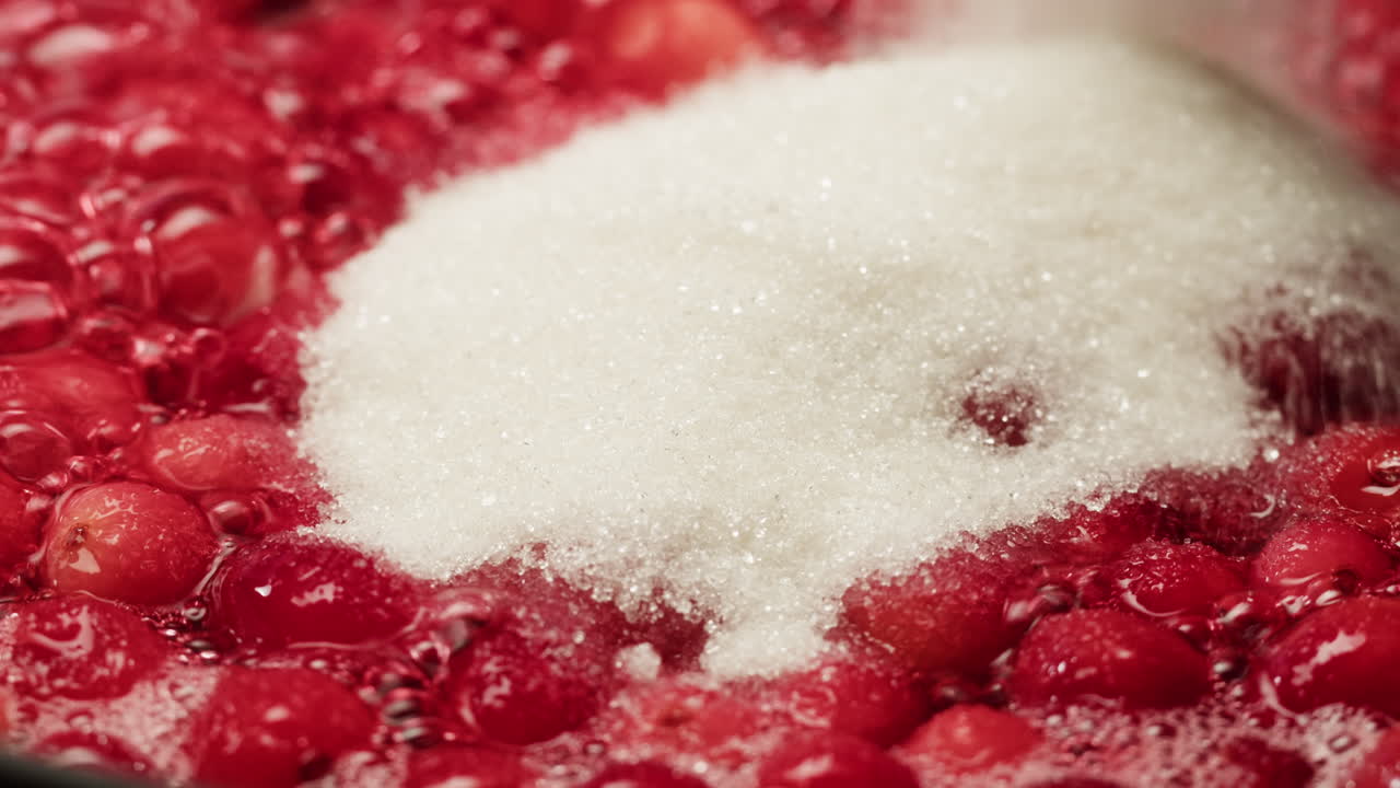 Frozen cranberries cooking for tea or jam, Background Close up of cranberry berries in on the kitchen, chef making dessert healthy pie.