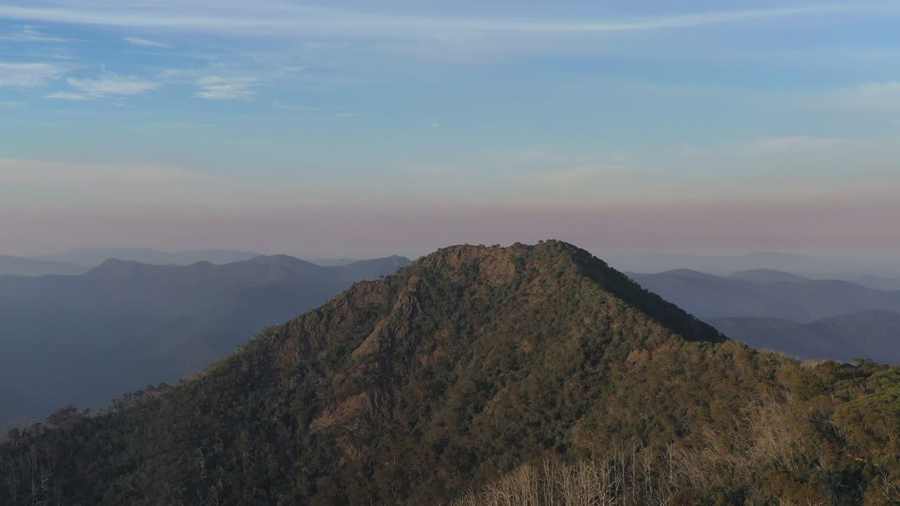 Aerial of Mountain range, treetops, in Outback Australia flyover with drone