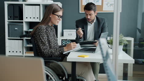 Business Meeting in an Office with a Woman in a Wheelchair