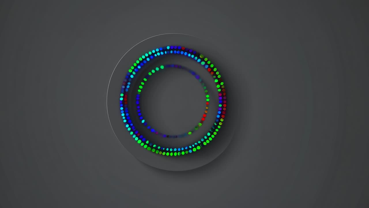 Top-down view of colorful, circular LED lights arranged in concentric rings on a dark background