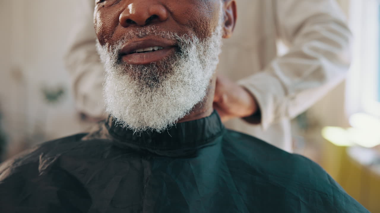 Close-up of Senior Man Getting Barber's Cape Placed