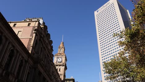 clock tower and skyscraper in melbourne cityscape