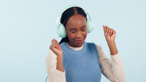 Woman,-dance-and-music-headphones-in-studio-to