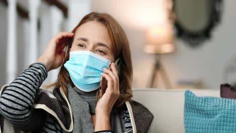 close up sick woman wearing a medical mask and a warm scarf