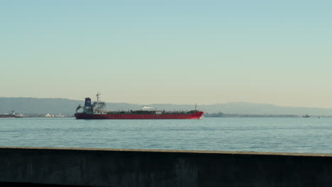 large cargo shipping boat with nautical goods in harbor