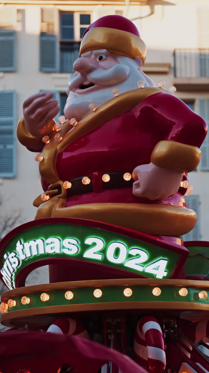 Close up of a Christmas carousel spinning in the evening. Vertical