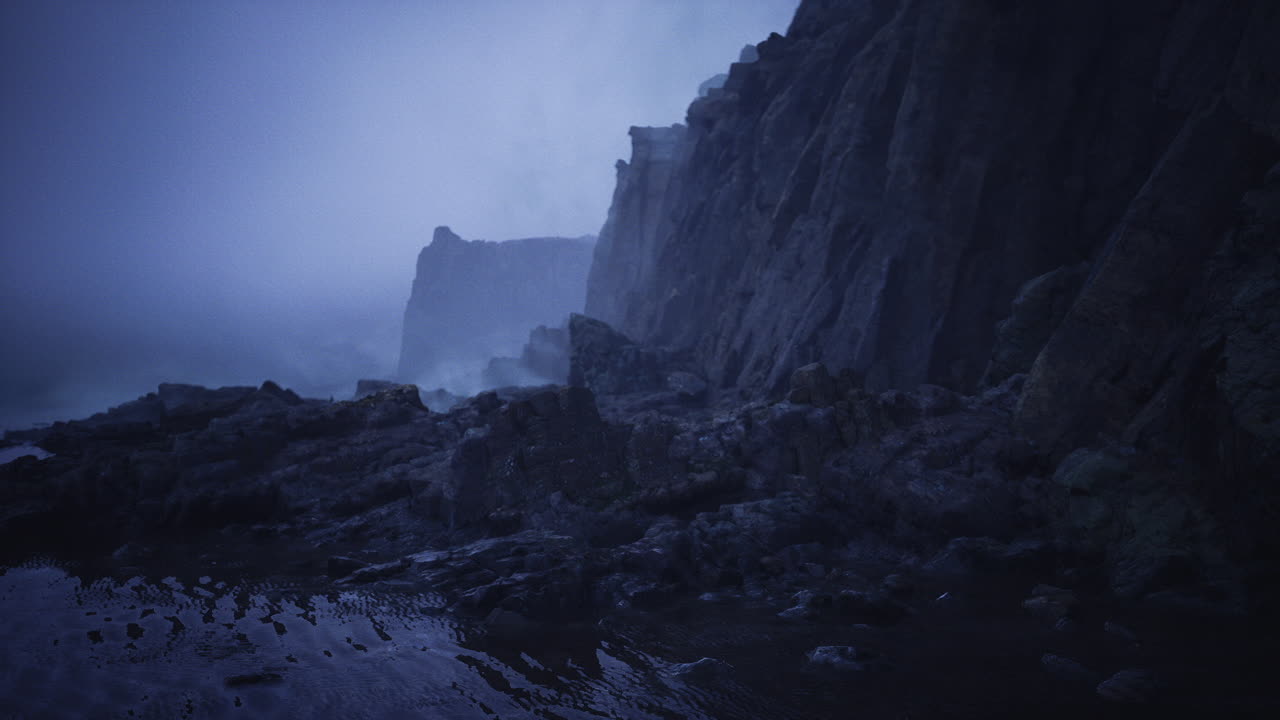 Desolate headland with rugged formations and damp stony shore