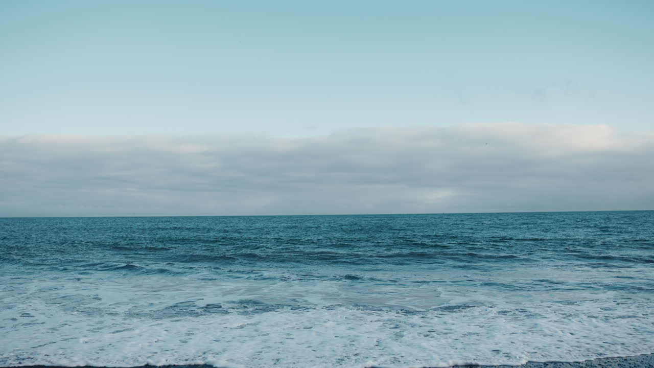 Reynisfjara Beach, Iceland, minimalistic, blue tones, serene and tranquil