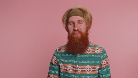 a happy man with a red beard and blonde hair looking up