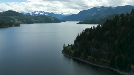 drone-shot-over-upper-reservoir-lake-near-campbell-river-on-the-orad-to-strathcona-provincial-park-on-vancouver-island-in-British-columbia,-canada