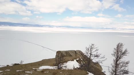 frozen lake with rocky outcrop