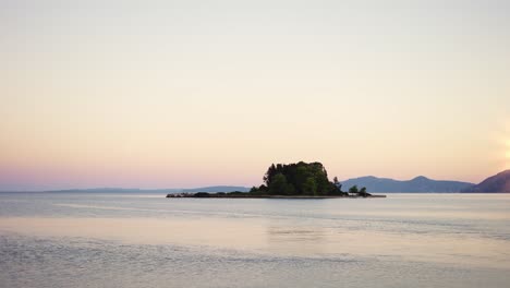 lonely rocky island among open sea or ocean