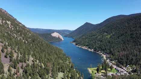 Bask-in-Nature's-Splendor:-Exploring-Paul-Lake-in-Kamloops-on-a-Sun-Drenched-Day,-Encircled-by-Forested-Peaks