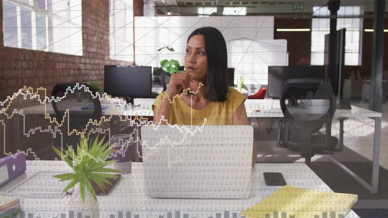 Woman typing while data overlay and graphs sliding over laptop causing pausing and analyzing market