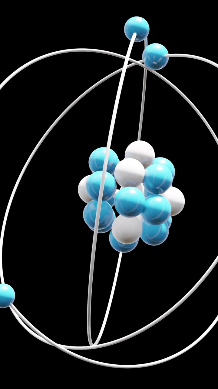 Animation of atom model spinning on black background