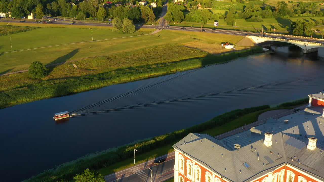 Aerial View of a River with a Boat and Building