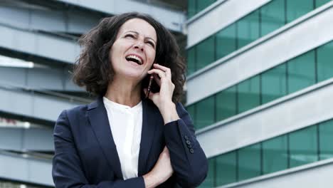 Content-businesswoman-talking-by-cell-phone