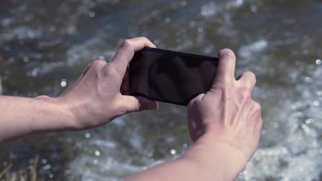 taking pictures by the river