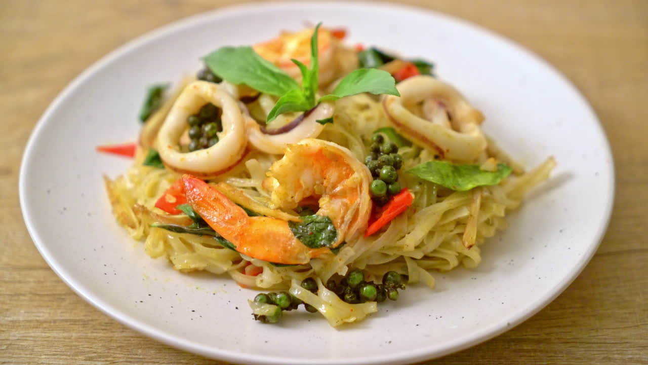 stir fried spicy noodles with sea food (Pad Cha Talay) - Thai food style