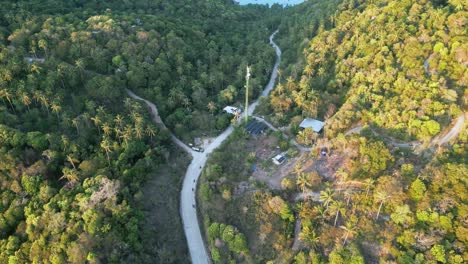 drone fly green koh tao thailand roads, motorcycles, solar panel houses travel southeast asian destination