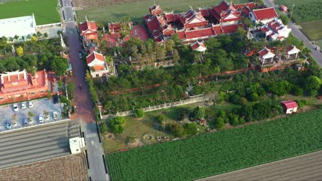 Flyover-the-Chifa-Matsu-Temple-in-the-middle-of-agricultural-fields,-a-sacred-site-dedicated-to-goddess-of-sea,-a-blend-of-cultural-heritage-and-rural-landscape,-Yunlin,-Taiwan,-aerial-drone-shot