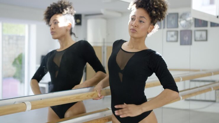 Attractive dedicated young dancer practicing