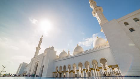 day light famous abu dhabi grand mosque down to top sunny sky panorama 4k timelapse uae